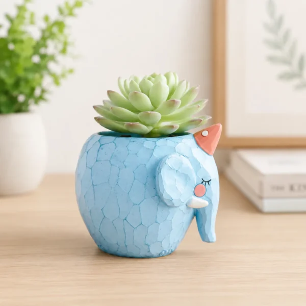 Blue diamond elephant planter with succulent placed on modern home table for decorative indoor decor