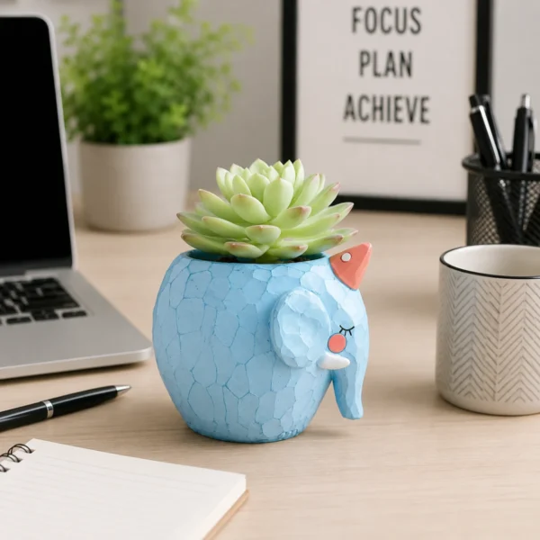Cute diamond elephant resin planter displayed on office desk with succulent plant and workspace accessories