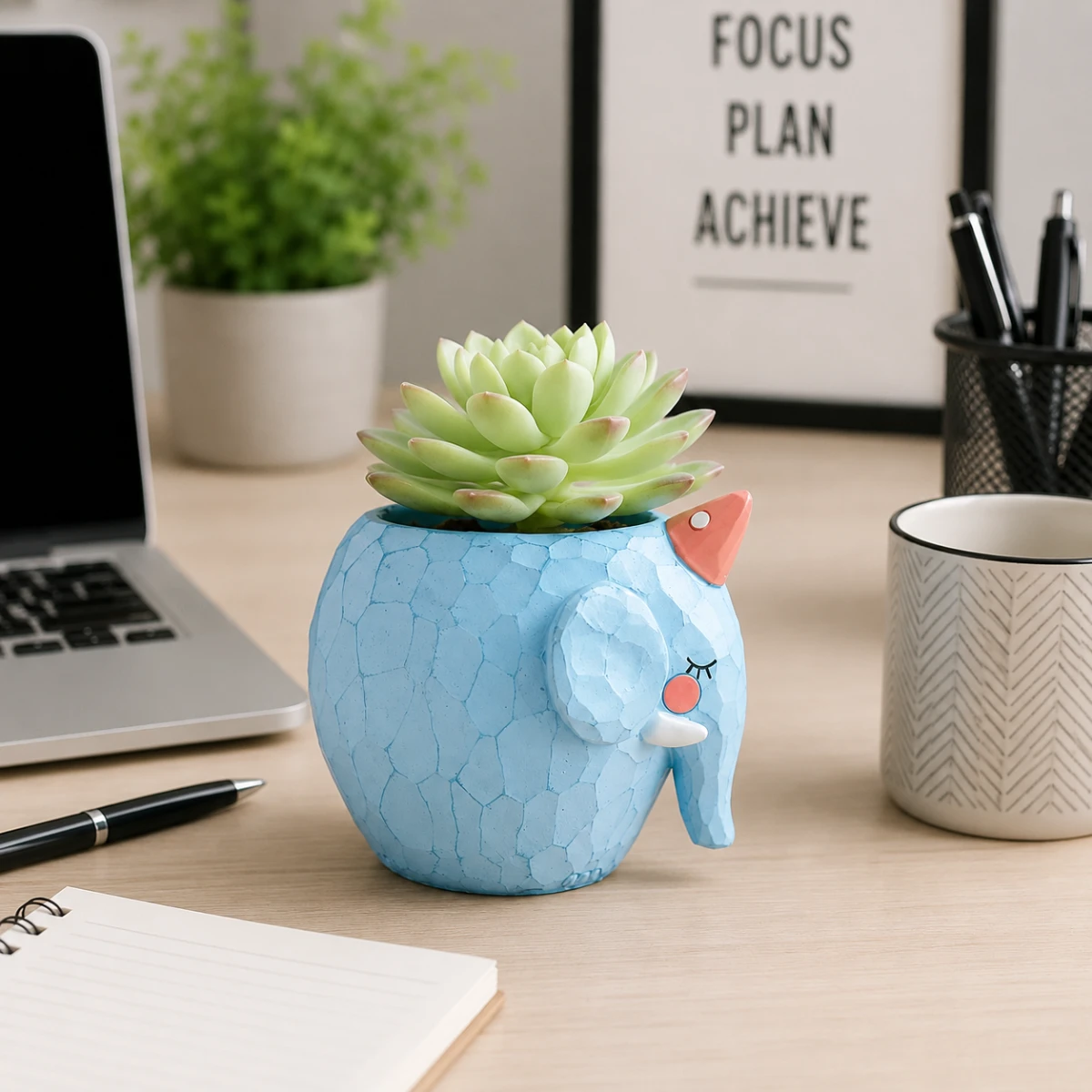 Cute diamond elephant resin planter displayed on office desk with succulent plant and workspace accessories