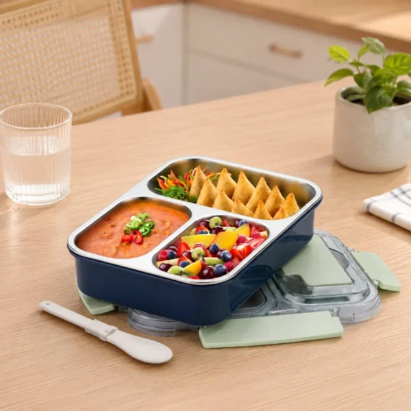 HOME LANE stainless steel lunch box placed on wooden dining table with healthy meal setup