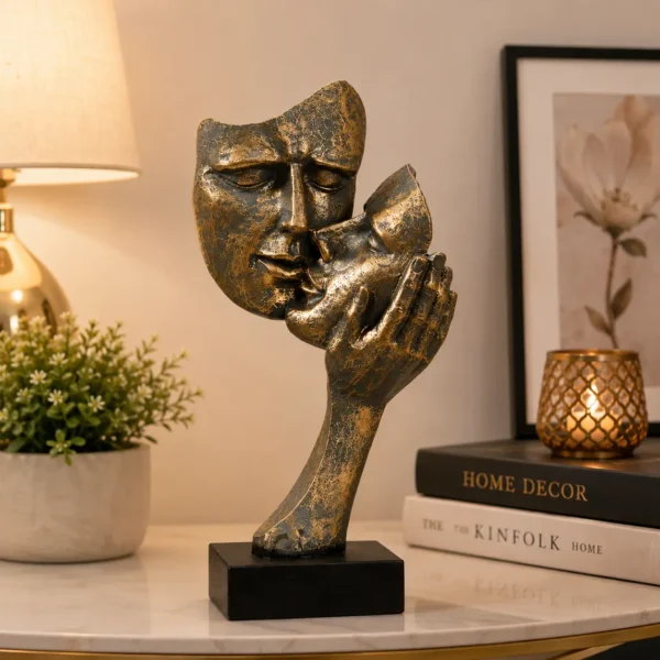 Brass colored abstract kissing couple resin statue on table décor