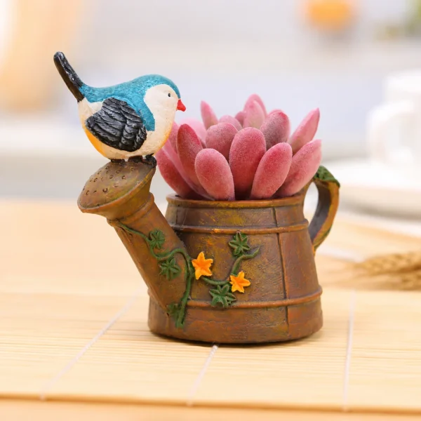 Bird kettle resin planter with pink succulent for home and table decor