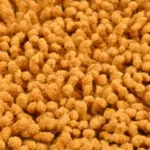 Green Tales mustard bathmat with non-slip backing for stability on wet bathroom floors
