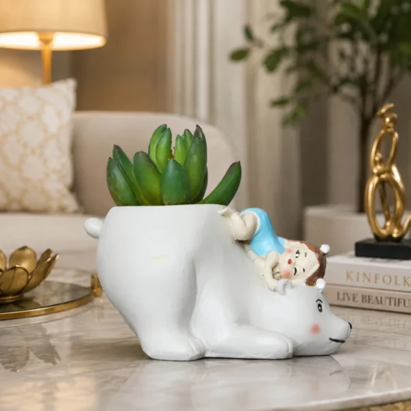 Cute resin blue bear planter with succulent displayed on modern living room table decor