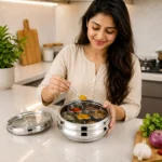 Stylish woman using premium stainless steel masala dabba while cooking in kitchen.