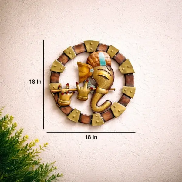 TINUMS golden Ganesha metal wall decor featuring Lord Ganesha playing flute