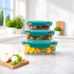 Reliable leakproof food storage containers stacked with fresh fruits for organized kitchen storage.