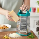 Top-quality box grater creating fine cheese shreds for pasta dishes.