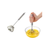 Durable stainless steel semi-automatic egg whisk mixing eggs with push-action handle.