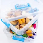 Spacious transparent organizer box filled with stuffed toys