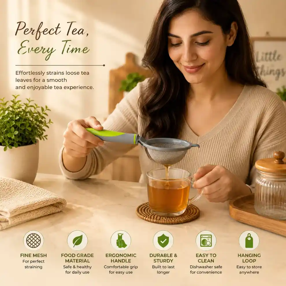 Premium tea strainer filtering loose tea leaves into glass cup.