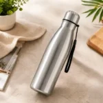 Elegant stainless steel water bottle on modern tabletop setting