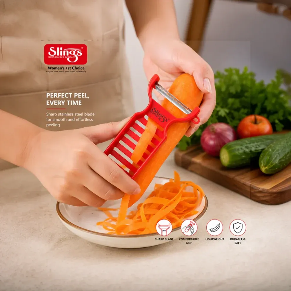 Professional vegetable peeler in use peeling fresh carrot with precision.
