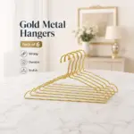 TINUMS slim golden metal hangers for efficient wardrobe organization